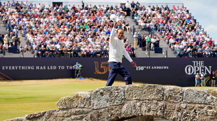 Tiger Woods walks across the famous Swilcan Bridge on the 18th hole at St. Andrews' Old Course on Friday of the 2022 British Open.